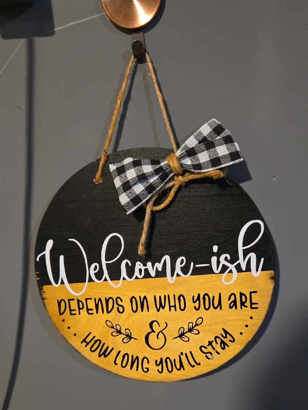 Welcome-ish Black and Yellow Round Wall Sign